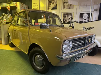 A classic Mini displayed among vintage motoring and music memorabilia at the Cotswold Motoring Museum