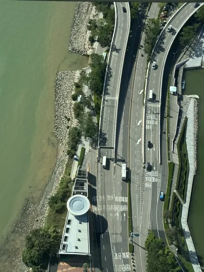 Looking down from Macau Tower at roads beside the waterfront