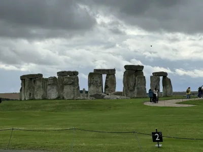 The standing stones of Stonehenge beneath a cloudy sky